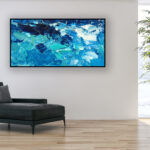 Abstract Ocean Painting on Canvas with rich impasto texture hanging in a modern living room with a black sofa