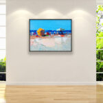 Beach oil painting on canvas with rich impasto texture hanging in a stylish living room, showing full room decor.