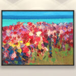 Beach painting with red flowers, original oil painting on canvas hanging on a modern wall