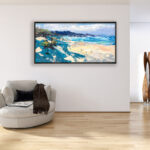 Beach painting, original oil painting on canvas hanging in a modern living room with a beige sofa and home decor