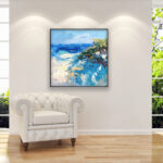 Beach painting, original oil painting on canvas hanging in a modern living room with a white sofa and home decor