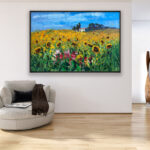 Landscape painting with sunflowers, original oil painting on canvas hanging in a modern living room with a beige sofa and home decor