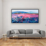 Landscape painting with lavender, original oil painting on canvas hanging in a modern living room with a gray sofa