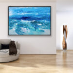 Ocean painting, original oil painting on canvas hanging in a modern living room with a beige sofa