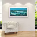 Ocean oil painting on canvas with rich impasto texture hanging in a stylish living room, showing full room decor.