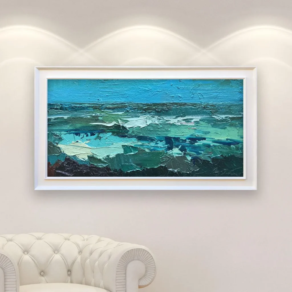 Ocean oil painting on canvas with rich impasto texture hanging in a modern living room with a white sofa