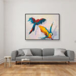 Parrots painting, original oil painting on canvas hanging in a modern living room with a gray sofa and home decor