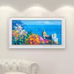 Positano Panoramic Painting on Canvas hanging in a modern living room with a white sofa and home decor