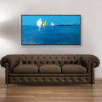 Sailboats oil painting on canvas with rich impasto texture hanging on a modern wall with brown sofa