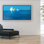 Sailboats oil painting on canvas with rich impasto texture hanging on a modern wall with black sofa