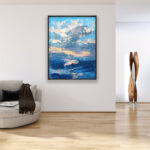 Modern seascape sunset oil painting on canvas with rich impasto texture hanging in a stylish living room, showing full room decor.