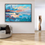 Sunset painting with Sailboat, original oil painting on canvas hanging in a modern living room with a beige sofa