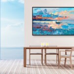 Sunset painting, original oil painting on canvas hanging in a modern living room with a table and ocean view