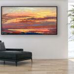 Sunset painting, original oil painting on canvas hanging in a modern living room with a black sofa