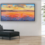 Sunset painting, original oil painting on canvas hanging in a modern living room with a black sofa