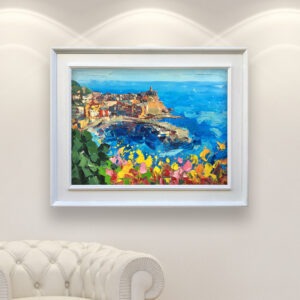 Vernazza Cinque Terre painting with cactus and flowers, original oil painting on canvas hanging in a modern living room with a white sofa and home decor