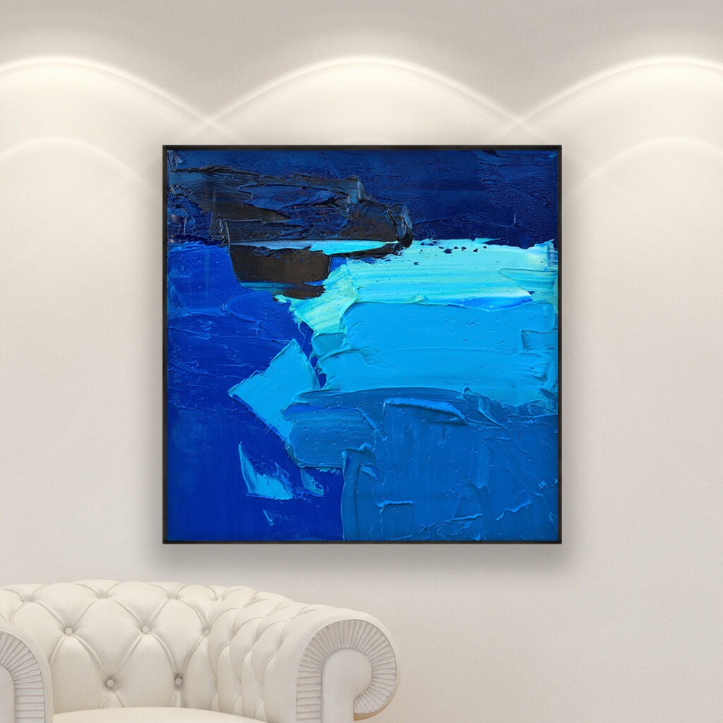 Abstract painting, original oil painting on canvas hanging in a modern living room with a white sofa and home decor