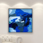 Abstract painting, original oil painting on canvas hanging in a modern living room with a white sofa and home decor