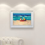 Modern Oil Painting on Canvas of a Beach with Children Playing hanging in a modern living room with a white sofa and home decor