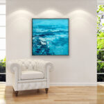 Teal blue abstract painting, original oil painting on canvas hanging in a modern living room with a white sofa and home decor