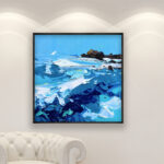 Ocean painting, original oil painting on canvas hanging in a modern living room with a white sofa and home decor