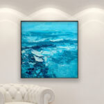 Teal blue abstract painting, original oil painting on canvas hanging in a modern living room with a white sofa and home decor