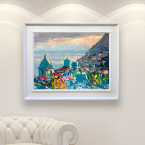 Positano at sunset oil painting on canvas, original modern impressionist Amalfi Coast wall art, framed, perfect for living room wall decor and as unique gift for her, displayed on the wall above a white sofa in a stylish living room