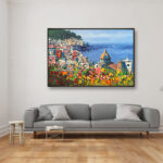 Positano painting with flowers and ocean view, original oil painting on canvas hanging in a modern living room with a gray sofa