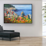 Positano painting with flowers and ocean view, original oil painting on canvas hanging in a modern living room with a black sofa