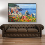 Positano painting with flowers and ocean view, original oil painting on canvas hanging in a modern living room with a brown sofa