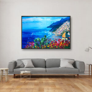 Positano painting with flowers and cactus, original oil painting on canvas hanging in a modern living room with a gray sofa