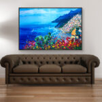 Positano painting with flowers and cactus, original oil painting on canvas hanging in a modern living room with a brown sofa