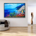 Positano painting with flowers and cactus, original oil painting on canvas hanging in a modern living room with a beige sofa