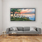 Seascape Painting at Sunset, original oil painting on canvas hanging in a modern living room with a gray sofa