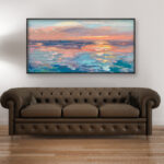 Abstract sunset painting, original oil painting on canvas hanging in a modern living room with a brown sofa