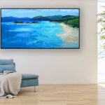 Beach painting, original oil painting on canvas hanging in a modern living room with a blue sofa