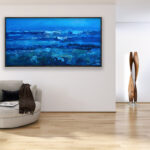 Blue ocean painting, original oil painting on canvas hanging in a modern living room with a beige sofa