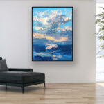 Modern seascape sunset oil painting on canvas with rich impasto texture hanging in a stylish living room, showing full room decor.